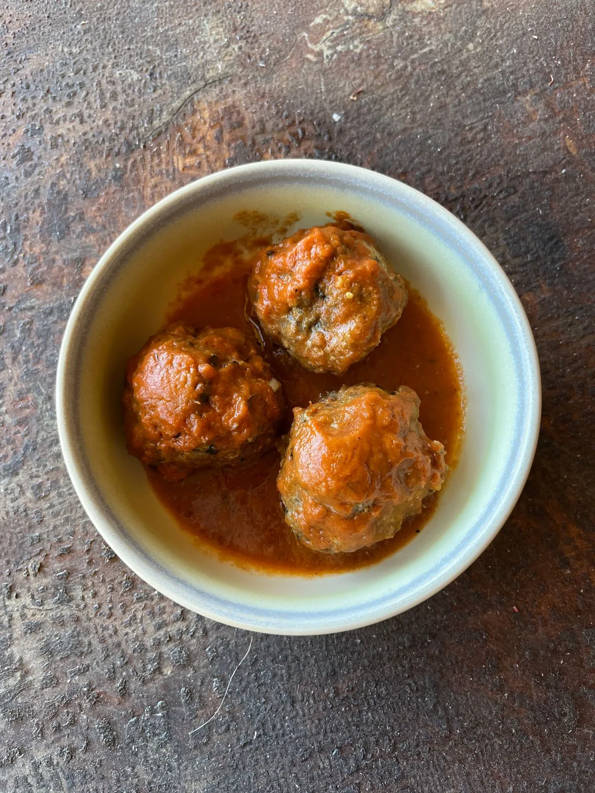 Baked meal prep meatballs on a sheet pan ready to portion