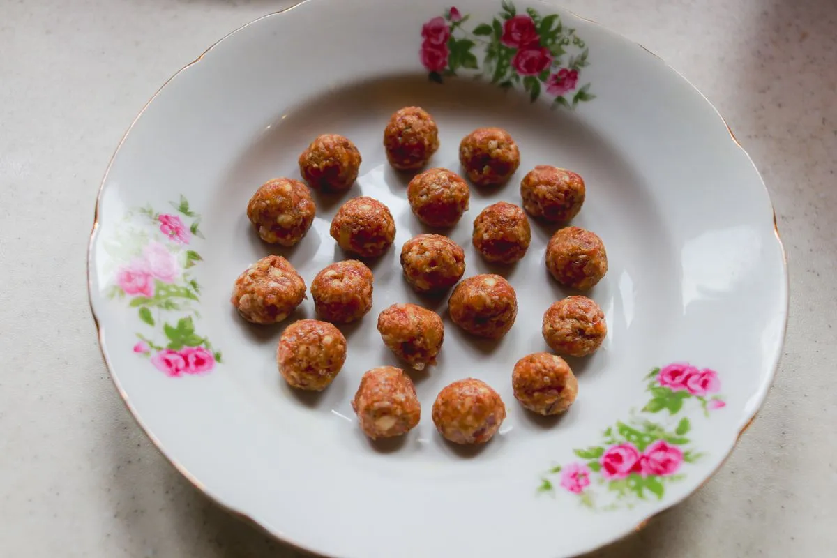 Five different meal prep bowls with meatballs